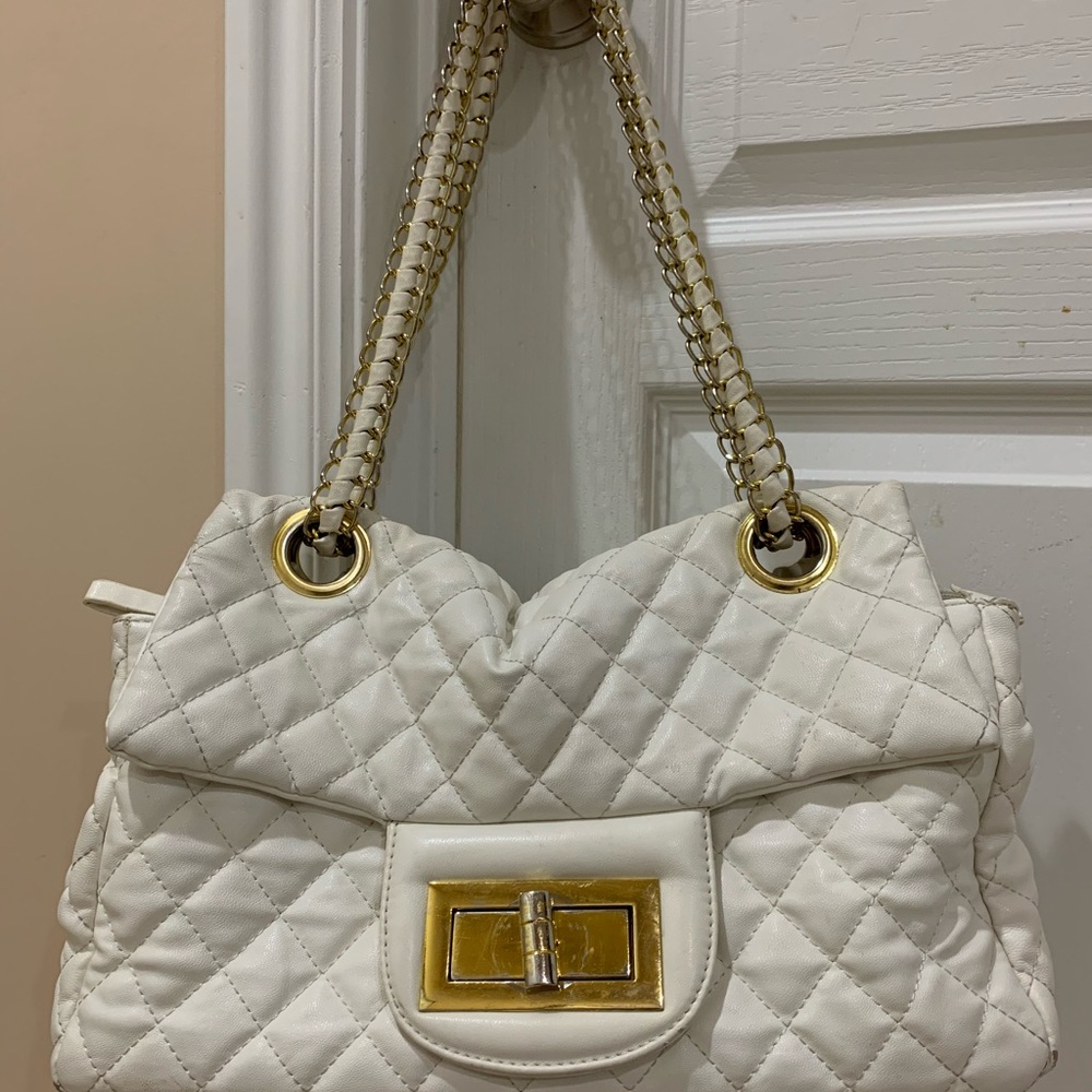 White purse with gold link chain straps
